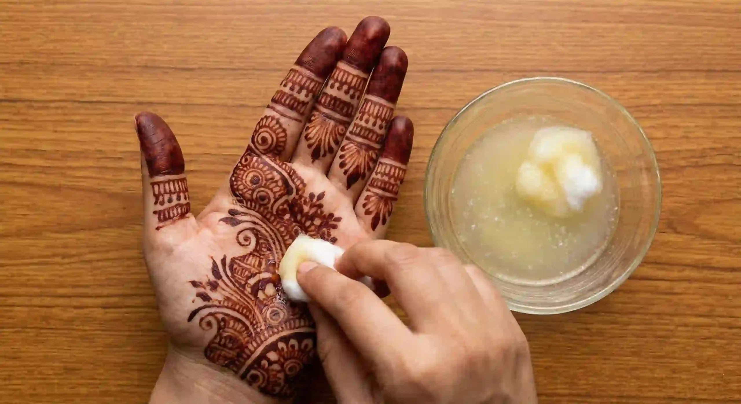 How to Make Mehndi Darker Naturally: 7 Secret Tips That Work 2 Dabbing lemon and sugar sealant onto dried henna to keep it moist.